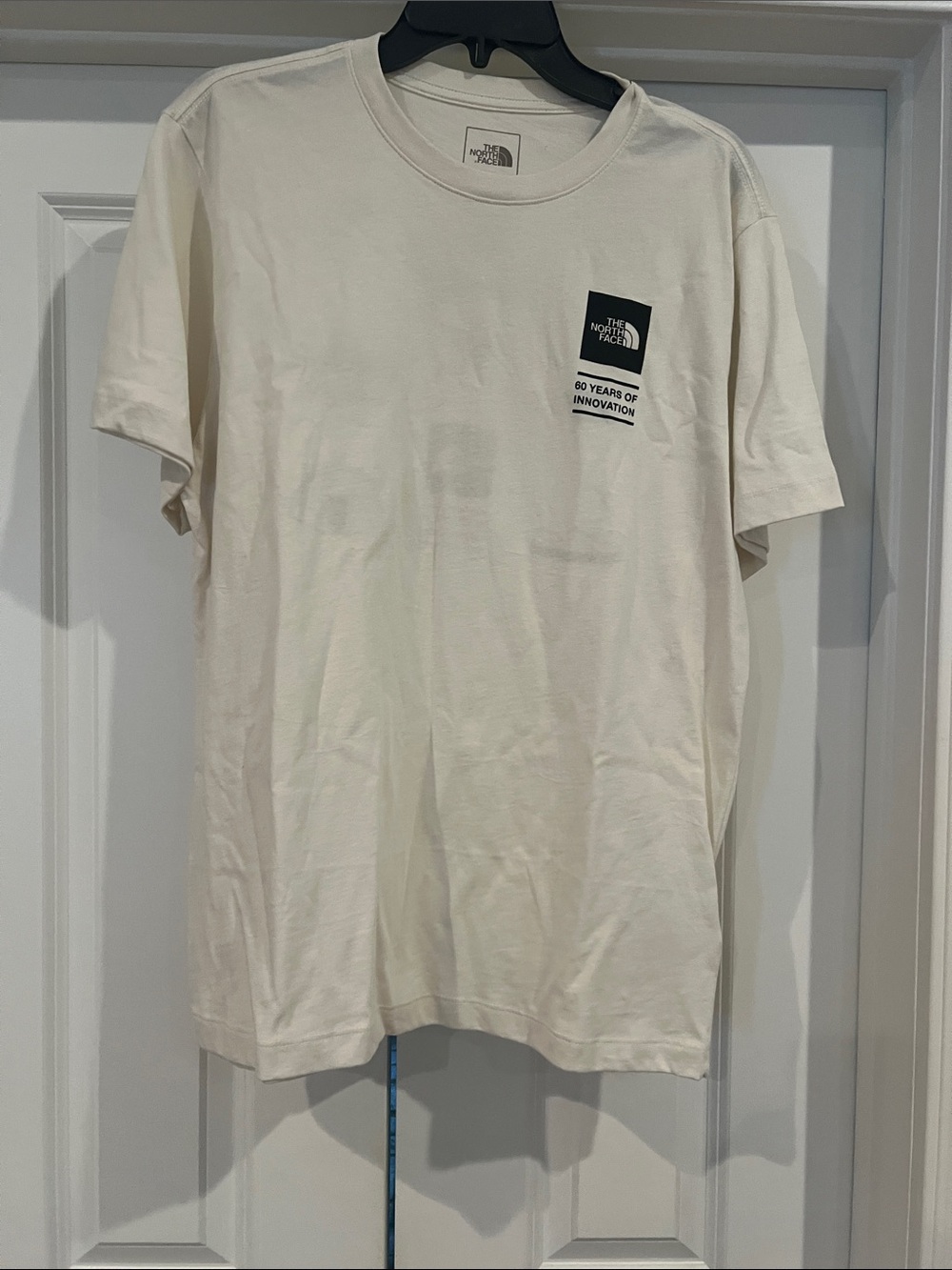 The North Face Men’s Short Sleeve Tee in Off-White with Black Logo